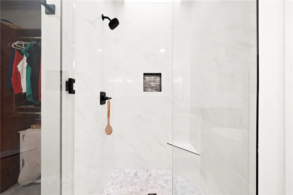 Walk-in shower with overhead skylight for natural light