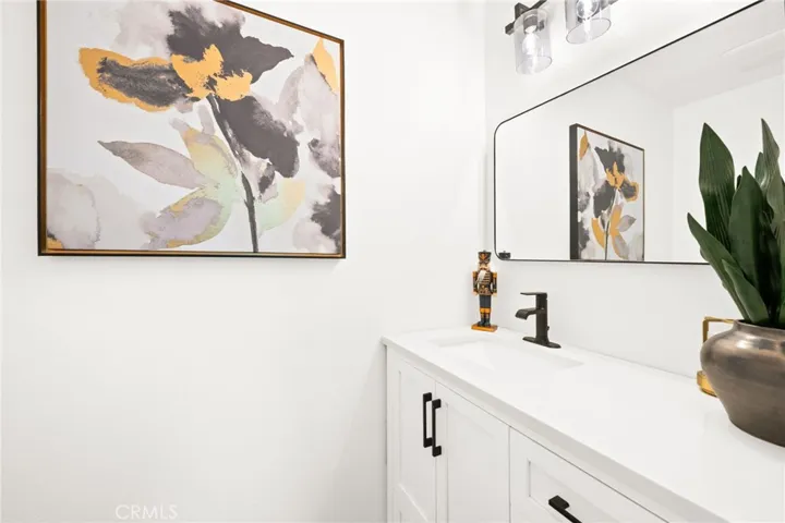 Stylishly updated guest bath with modern finishes