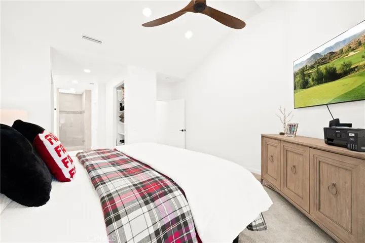 Bright secondary bedroom with clean, modern design