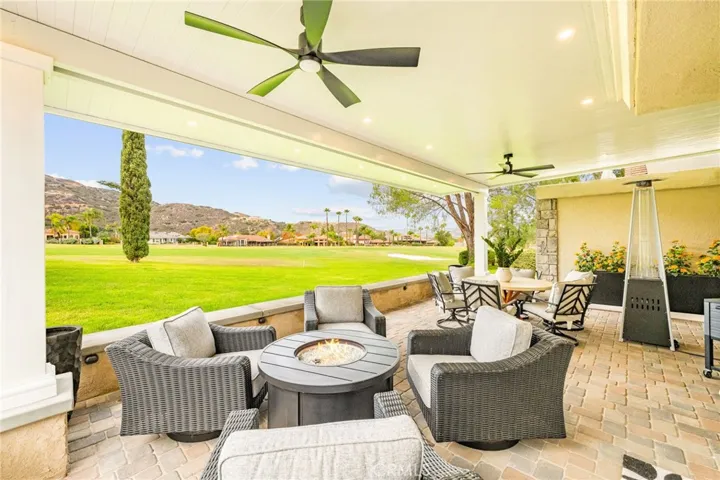 Covered patio with panoramic golf course views--perfect for relaxing or entertaining