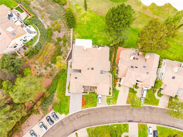 Aerial view showcasing the home's position along the 15th fairway