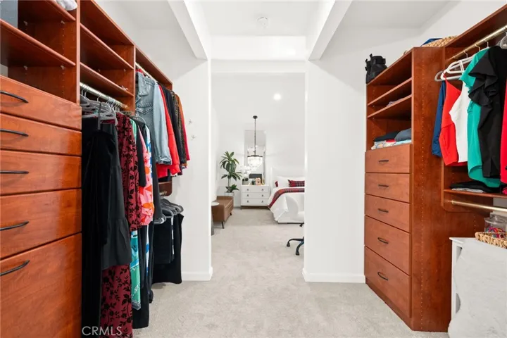 Generous primary closet with custom built-ins
