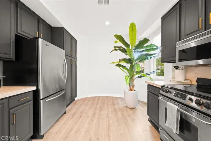 Updated kitchen with modern finishes, ample storage and clean lines