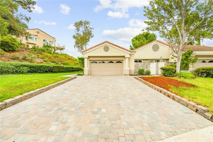 Inviting approach with newly paved driveway