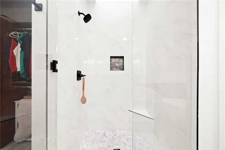 Walk-in shower with overhead skylight for natural light