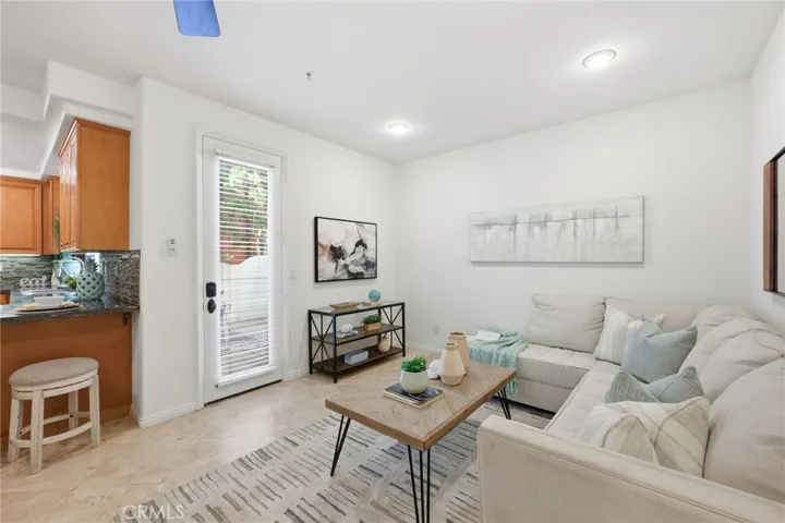 A closer look at the family room side of the space, with a door leading out to the back patio.