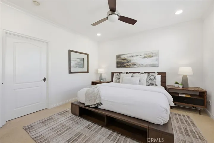 The primary suite is a great space with lots of light, thru the large shuttered windows. There is a ceiling fan in addition to the newer AC unit in the home.