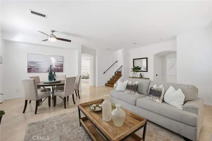Here is the spacious living room/dining room with a view of the family room & Kitchen beyond and the staircase leading up to the bedrooms
