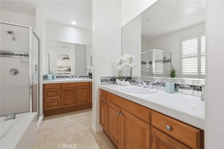 The primary bathroom with a separate walk-in shower and large soaking tub, 2 sink vanities and lots of storage. The water closet is located in a separate room just around the corner.