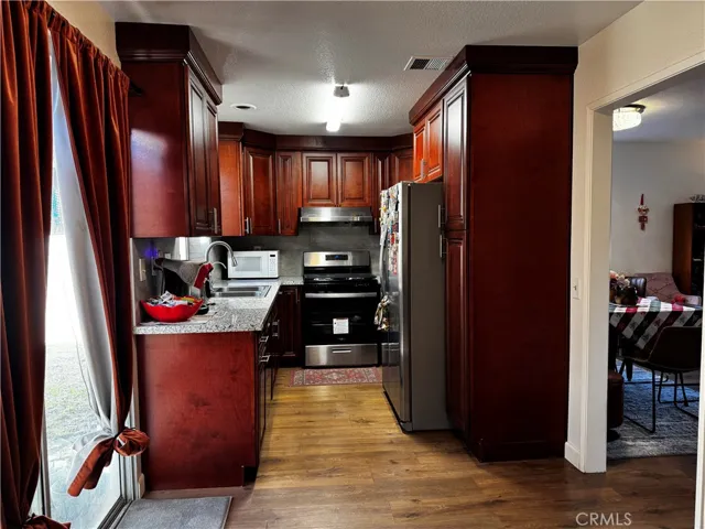 current kitchen with oversized refrige