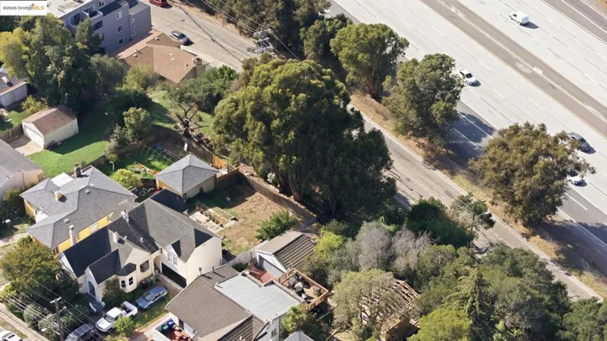 Aerial view of property's location with nearby suburban area