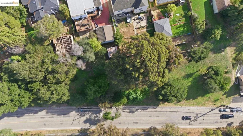 Aerial view of property's location featuring nearby suburban area