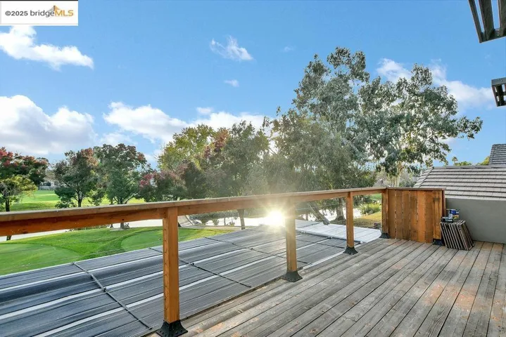 Wooden terrace with a lawn