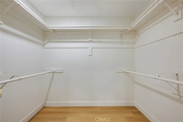 Walk in closet in primary bedroom