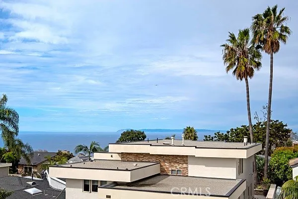 Ocean and Catalina Island view home in beautiful Laguna Beach with three bedrooms plus an office.