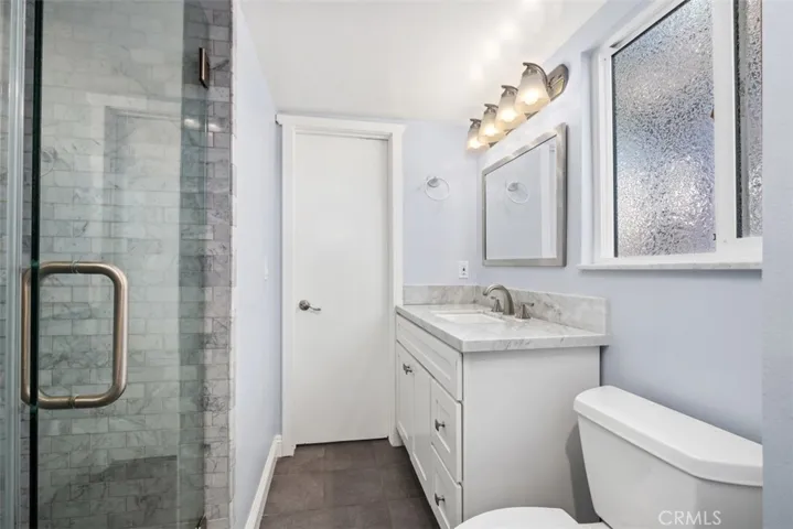 Designer tile adds glam to the two updated bathrooms