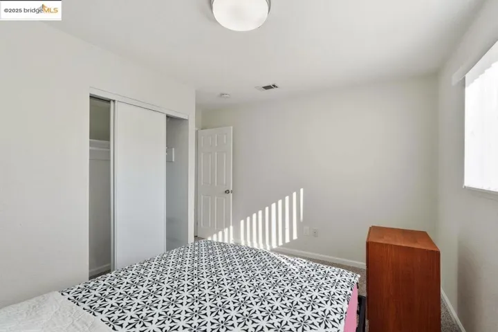 Bedroom featuring a closet and carpet floors