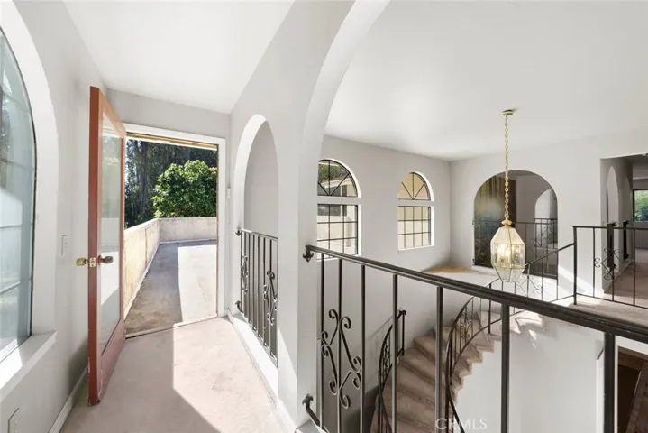 Walkway from primary bedroom past balcony to roof top veranda