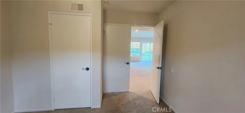 1st front facing bedroom with double doors