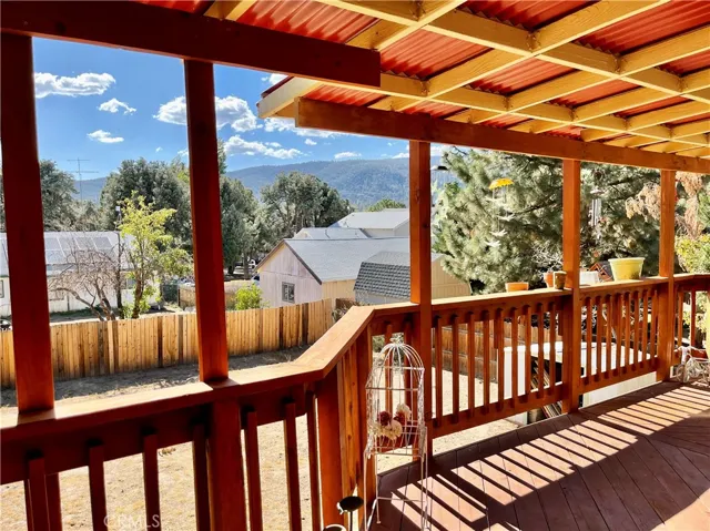 Wrap around deck with view of the backyard and Neighbourhood