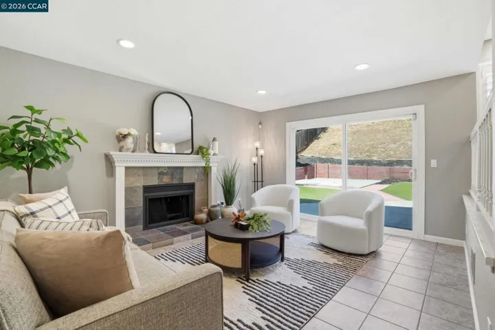 WITH FIREPLACE AND SLIDER TO PATIO.