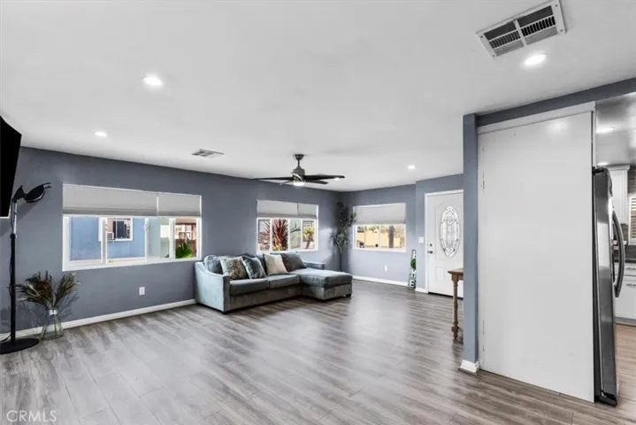 Dining area with contemporary lighting and seamless flow to kitchen