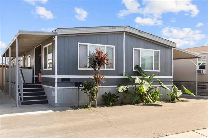 Front exterior angle highlighting architectural details and driveway access