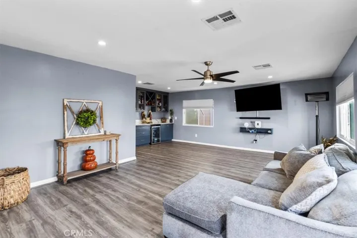 Primary bathroom with double vanity, modern mirrors, and updated fixtures