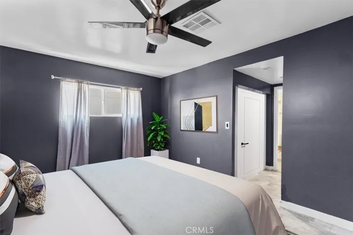 Bedroom view highlighting natural light and ceiling fan