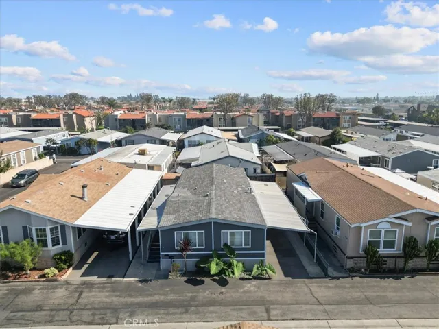 Aerial neighborhood view showcasing surrounding homes and community layout