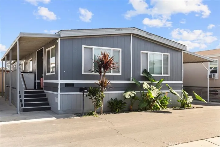 Front exterior angle highlighting architectural details and driveway access