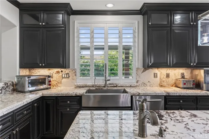 Kitchen has all the ambience a kitchen can have. Two Sinks, Stainless Appliances, Great Cabinets and Granite countertops with a unique flow to the design.