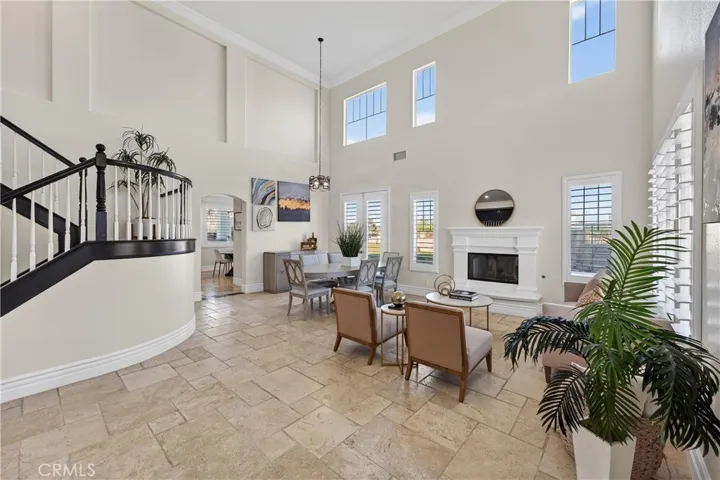 Tile extends to the dining area.  Note Fireplace and spaciousness