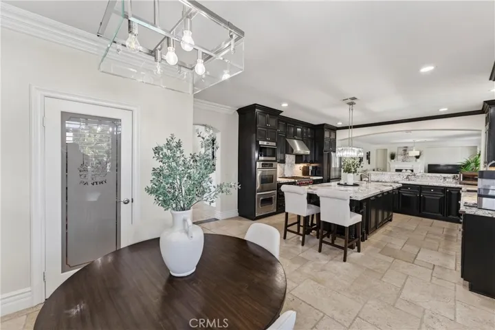 Breakfast nook and walk in pantry. Note the crown molding and spacious kitchen