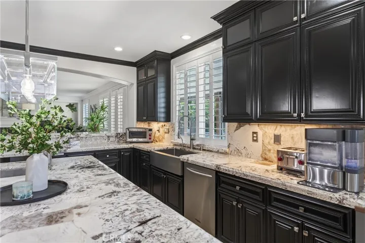 Striking, high-end granite with dramatic veining and a soft blend of whites, creams, and charcoal tones—creating a truly custom, designer look.