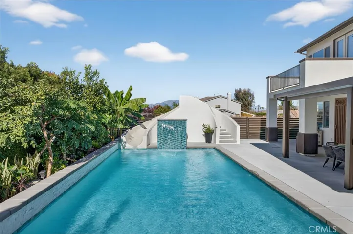 With a Luxurious pool and spa to enjoy! This is one of two backyard areas. Note aluma-wood patio & balcony