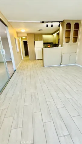 Living Room to Kitchen view. Beautiful Tile Floor.