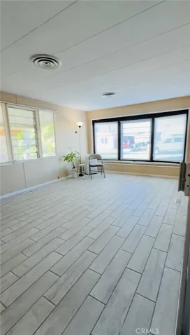 Bright Living Room with nice and ez to maintain tile flooring.