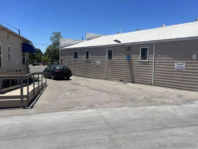 Comes with one space in rear of building