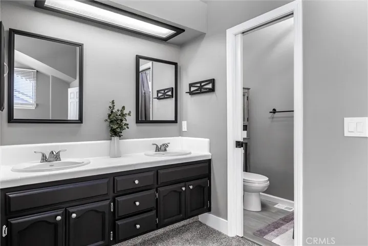 Primary- double vanity. Private shower/toilet.