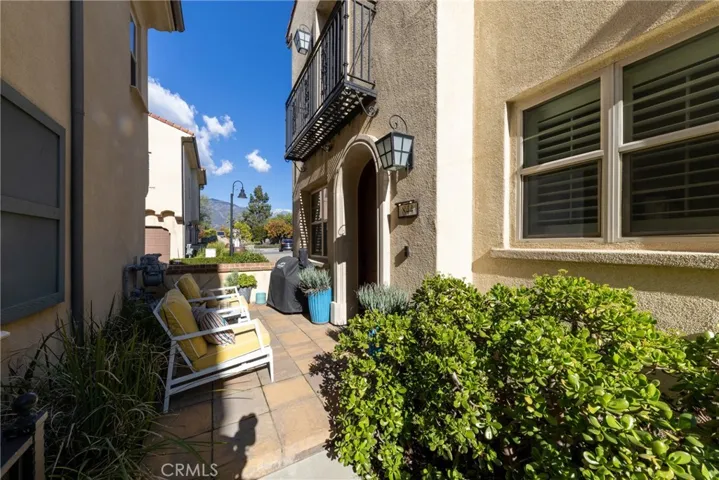 End unit with a front patio looking out to the mountain view.