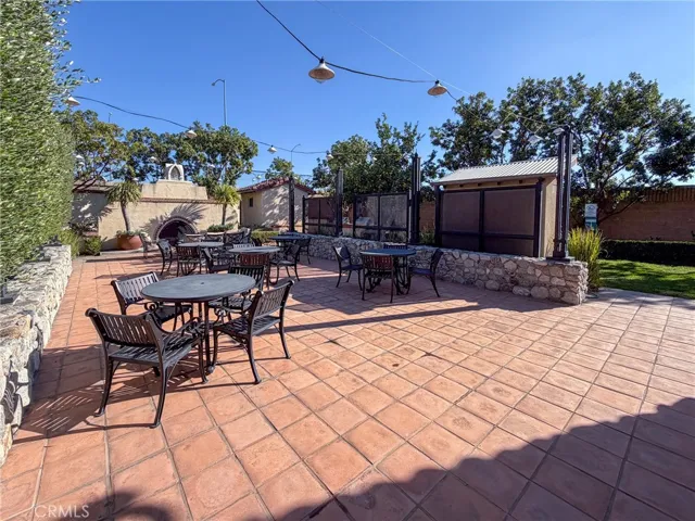 A patio area with BBQs, a fireplace, and plenty of grass space are part of the communities amenities.