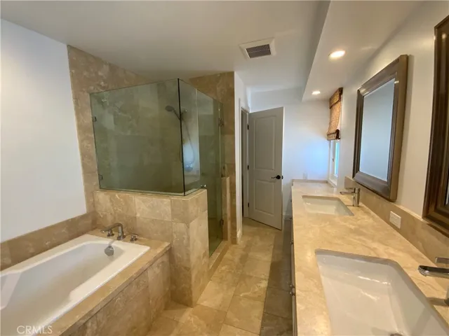 Elegant Primary Suite Bath With Shower and Soaking Tub