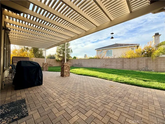 Covered patio in back yard