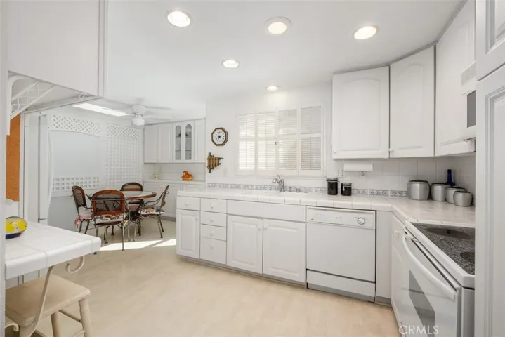 Crisp white kitchen with breakfast nook!