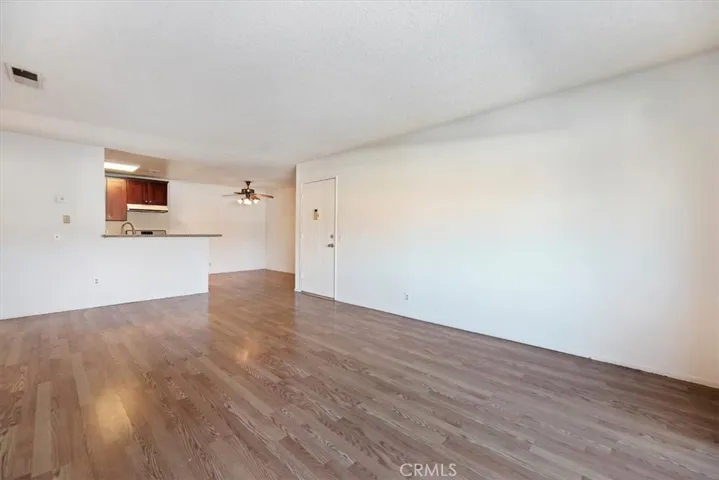 living room with kitchen and dining room