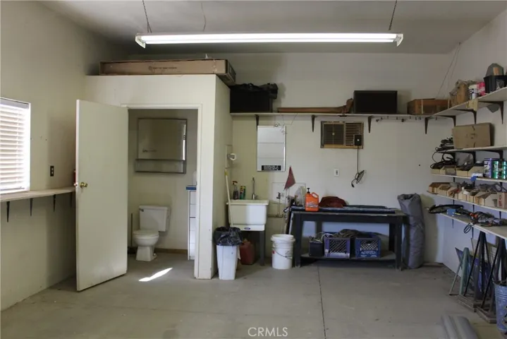 Workshop in rear garage with bathroom and utility sink