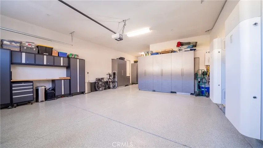 3-Car Tandem Finished Garage With Built-In Cabinets & Epoxy Floor