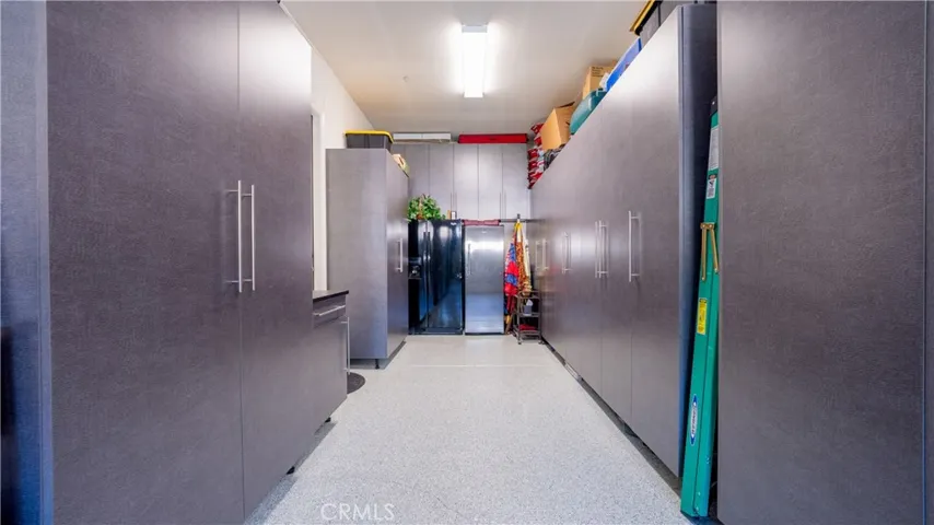 3-Car Tandem Finished Garage With Built-In Cabinets & Epoxy Floor