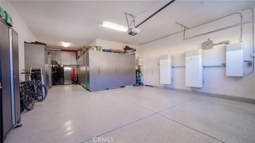 3-Car Tandem Finished Garage With Built-In Cabinets & Epoxy Floor
